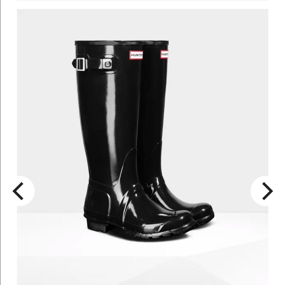 Tall glossy black hunter rain boots.